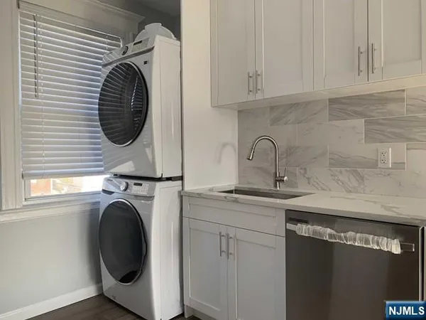 a kitchen with a sink and a washer
