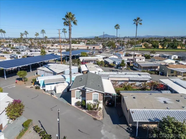 a bed room with a bed and a chair