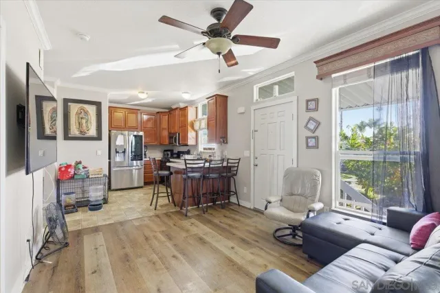 a kitchen with a sink refrigerator and cabinets