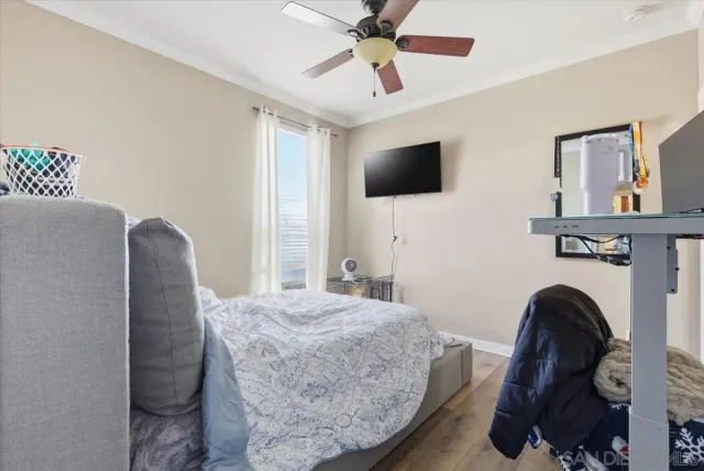 a white toilet sitting next to a bath tub