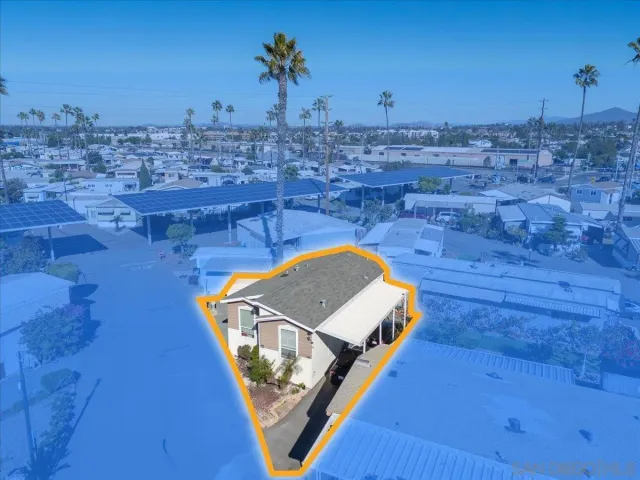 a wooden bench sitting in the middle of a yard