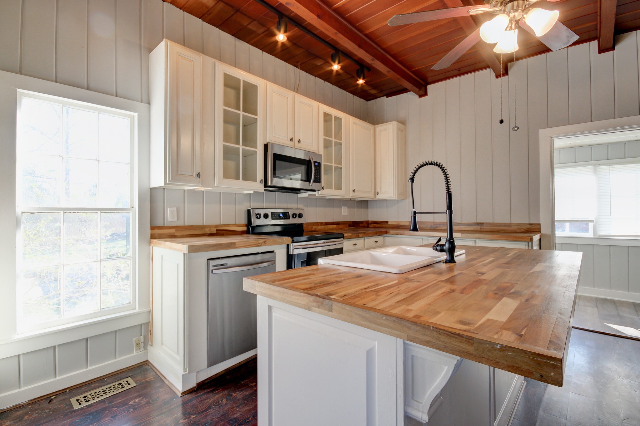389 3rd Street Guthrie, KY 42234 - Photo 21 of 69 a kitchen with granite countertop a stove a sink and a refrigerator