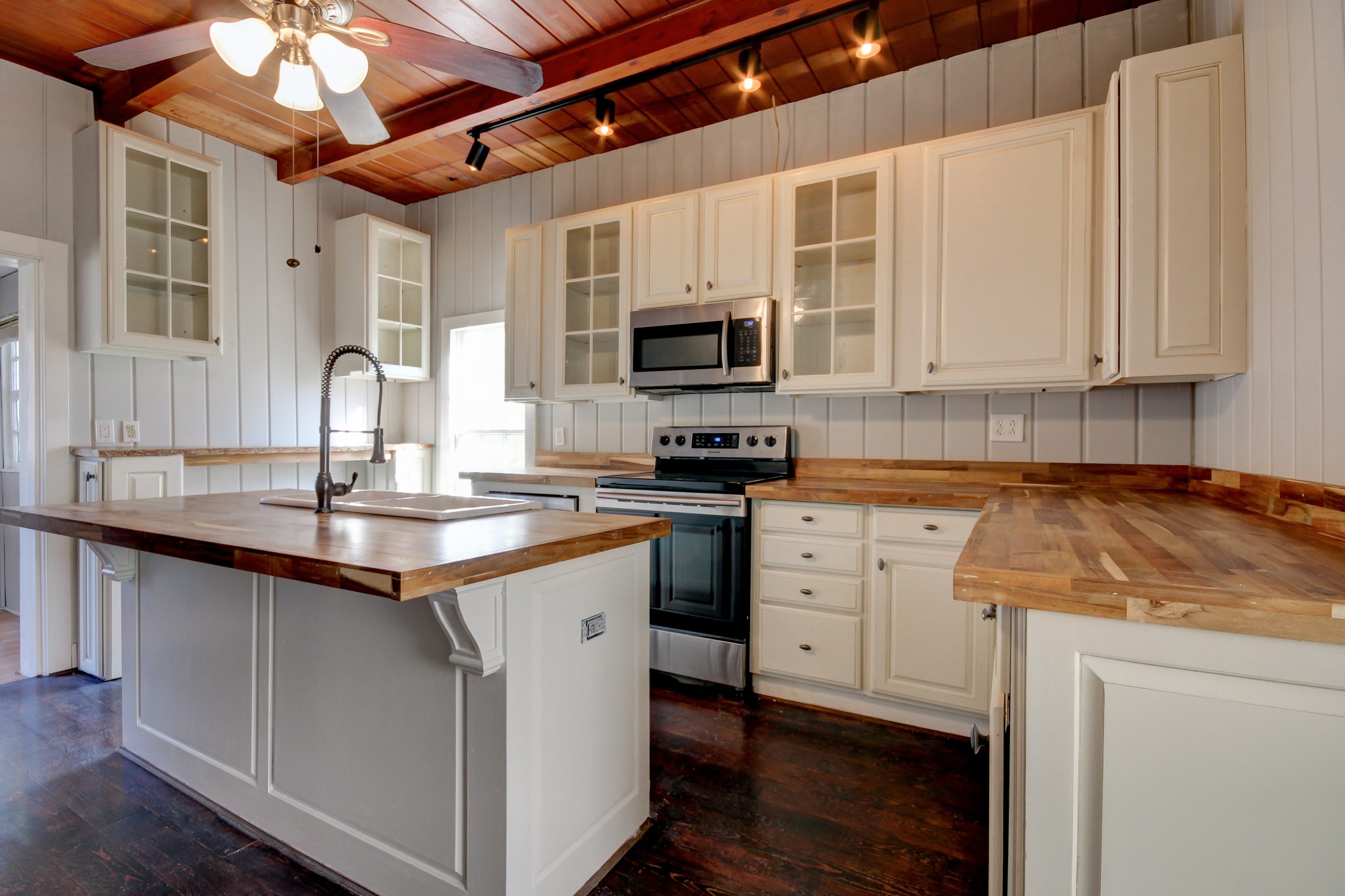 389 3rd Street Guthrie, KY 42234 - Photo 22 of 69 a kitchen with granite countertop a stove a sink and a microwave