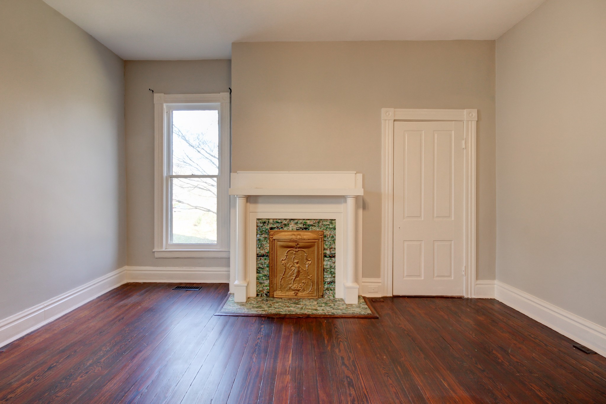 389 3rd Street Guthrie, KY 42234 - Photo 37 of 69 an empty room with wooden floor and a window