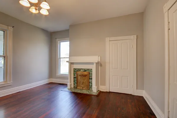 a room with fireplace and wooden floor