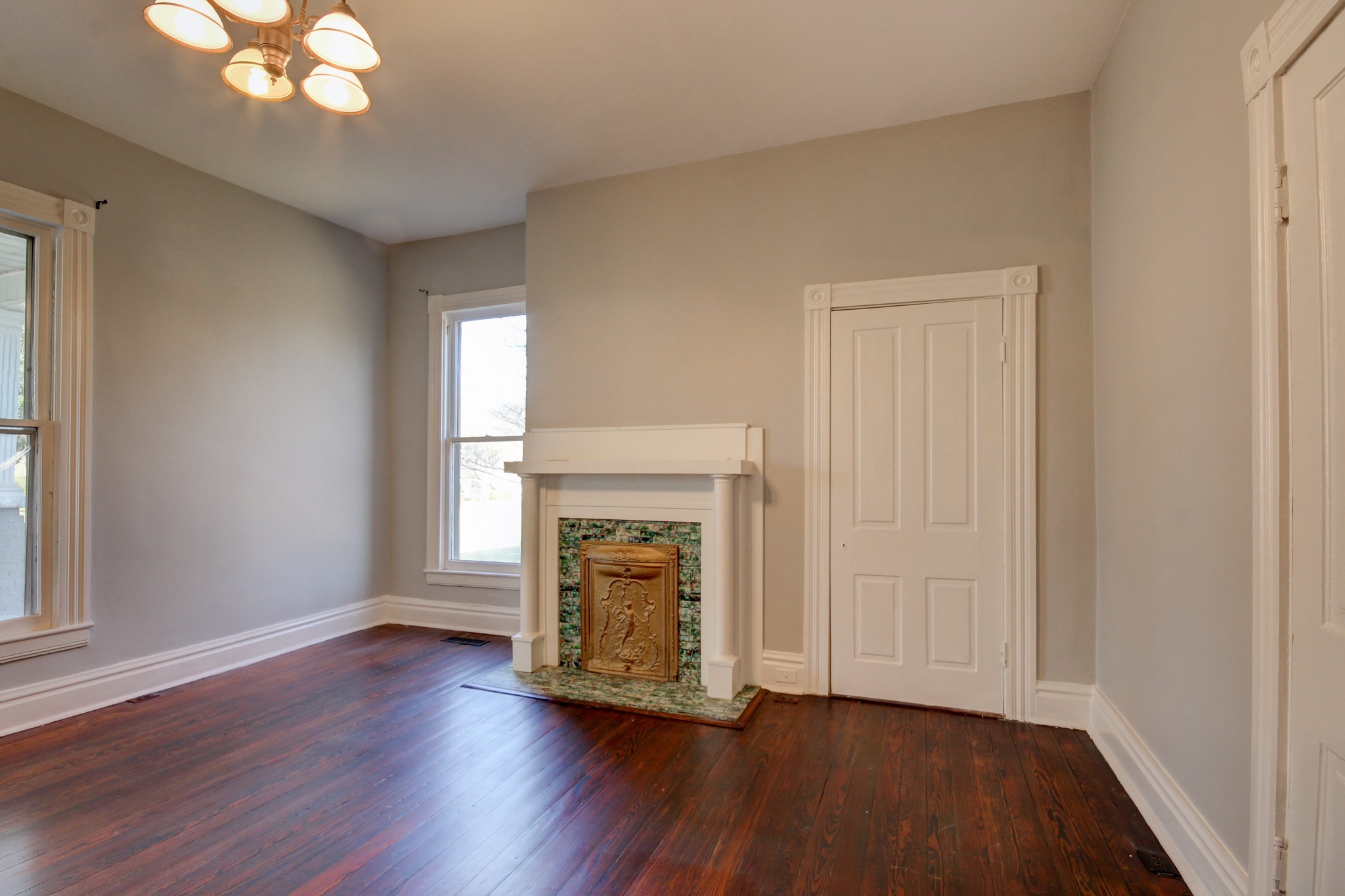 389 3rd Street Guthrie, KY 42234 - Photo 39 of 69 a view of an empty room with wooden floor and a window