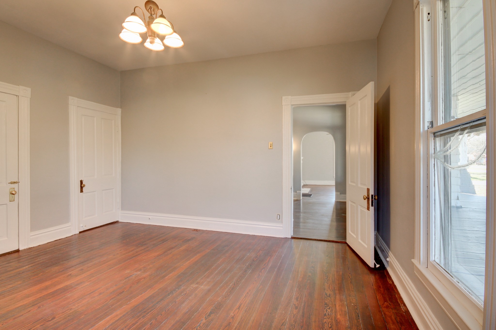 389 3rd Street Guthrie, KY 42234 - Photo 40 of 69 wooden floor in an empty room with a window