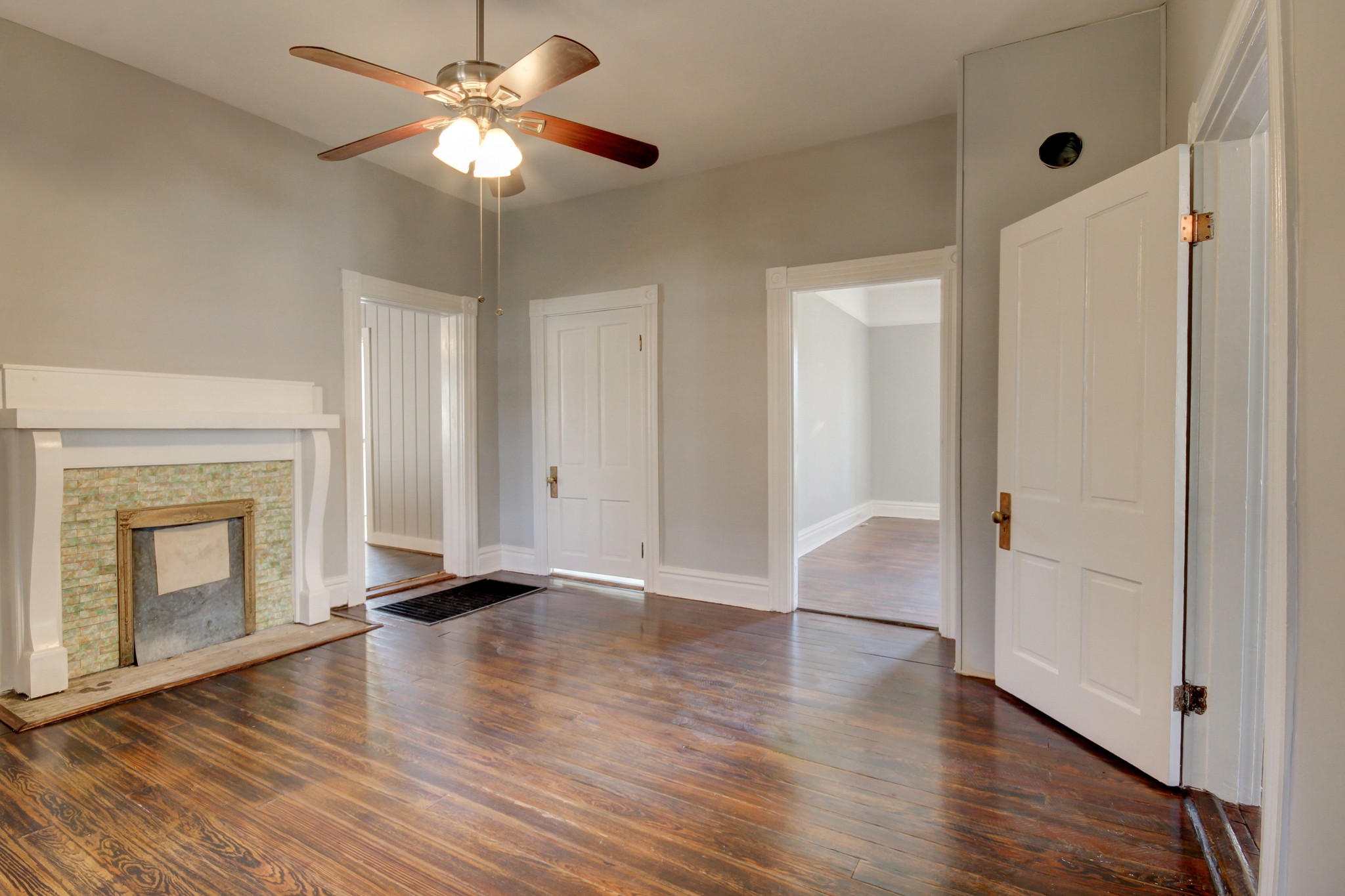 389 3rd Street Guthrie, KY 42234 - Photo 41 of 69 a view of an empty room with wooden floor and a fireplace