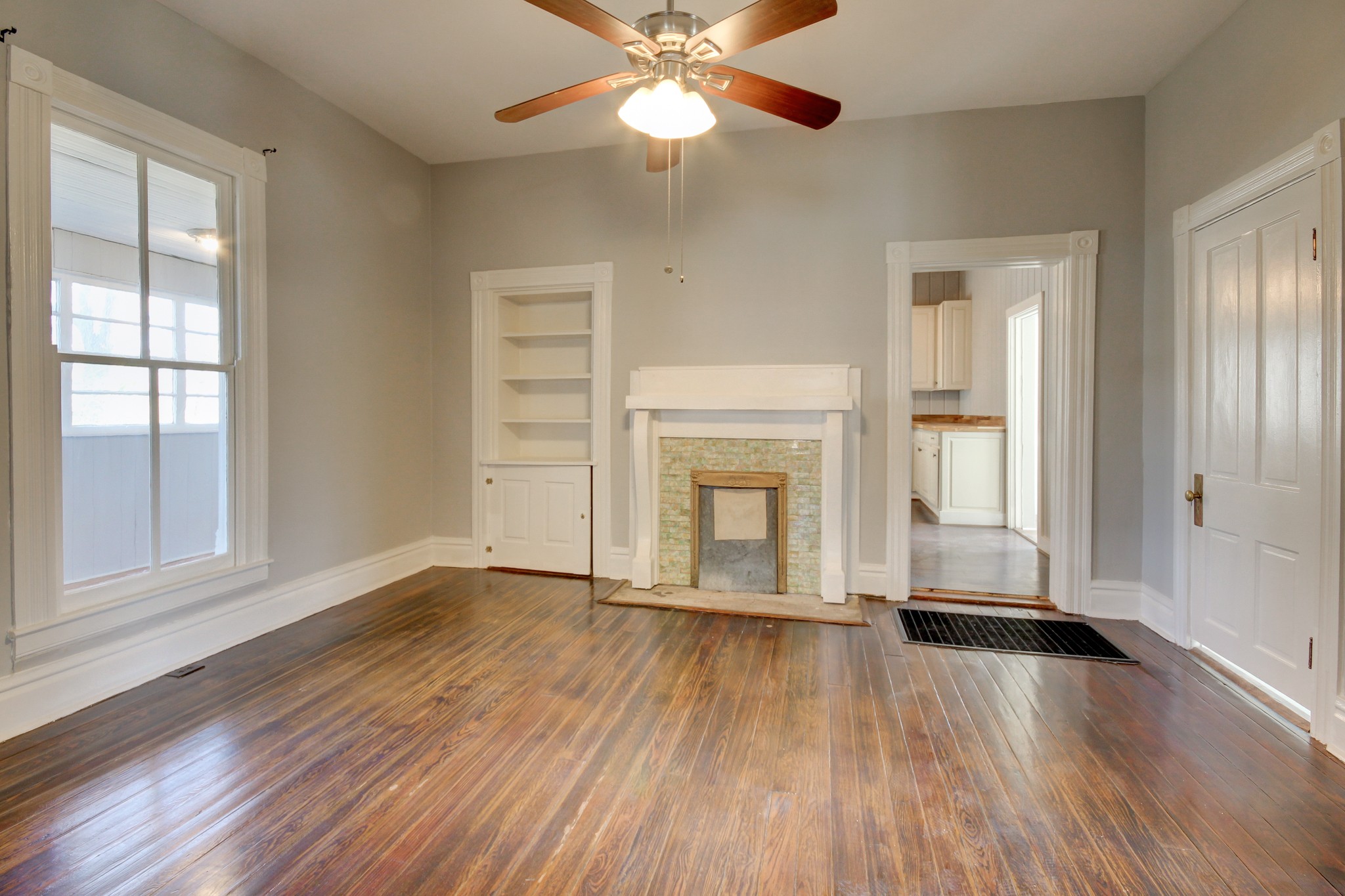 389 3rd Street Guthrie, KY 42234 - Photo 43 of 69 an empty room with wooden floor fan and windows