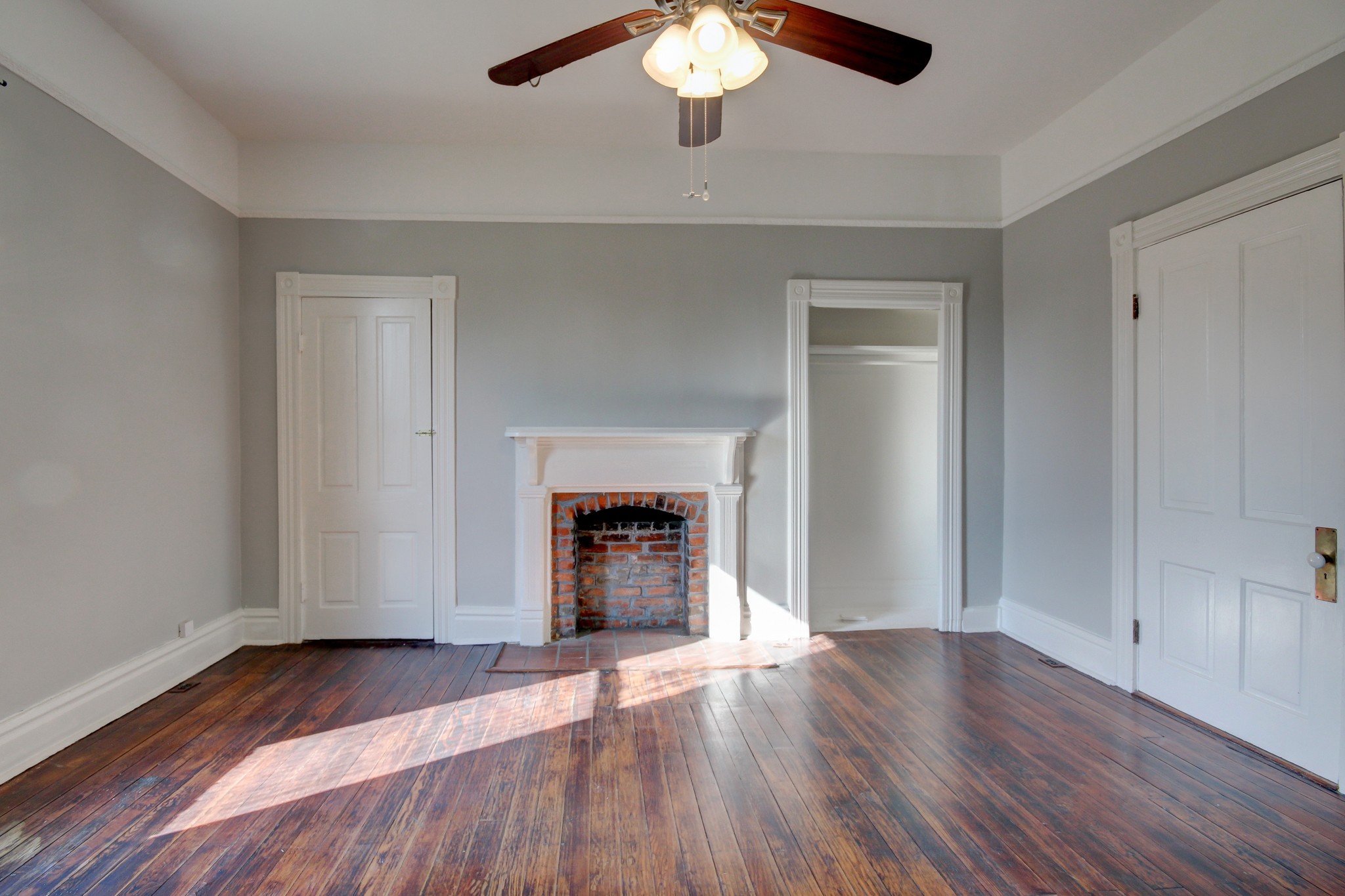 389 3rd Street Guthrie, KY 42234 - Photo 48 of 69 a view of an empty room with wooden floor and a window