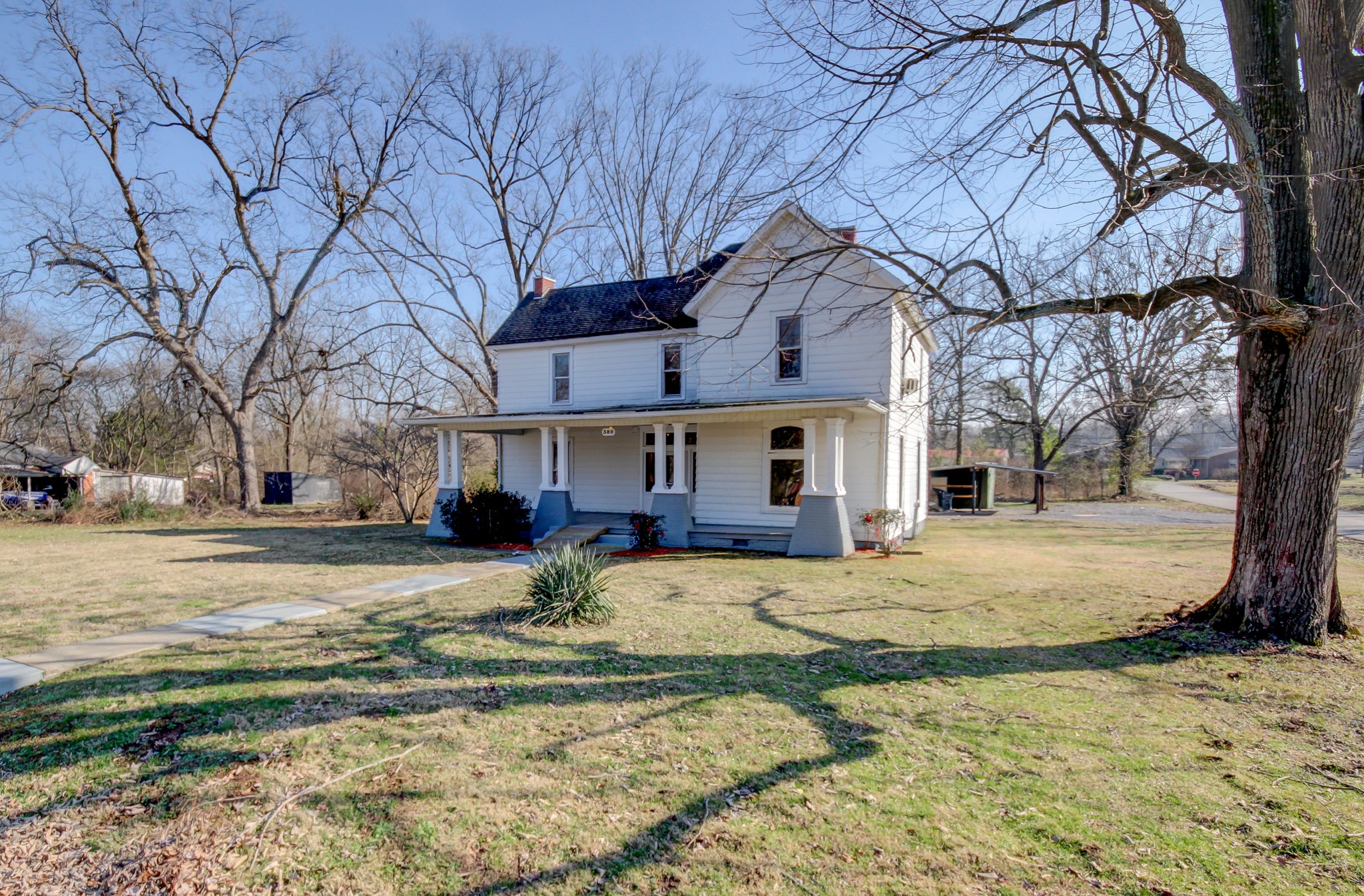 389 3rd Street Guthrie, KY 42234 - Photo 5 of 69 a view of a house with a yard covered in snow