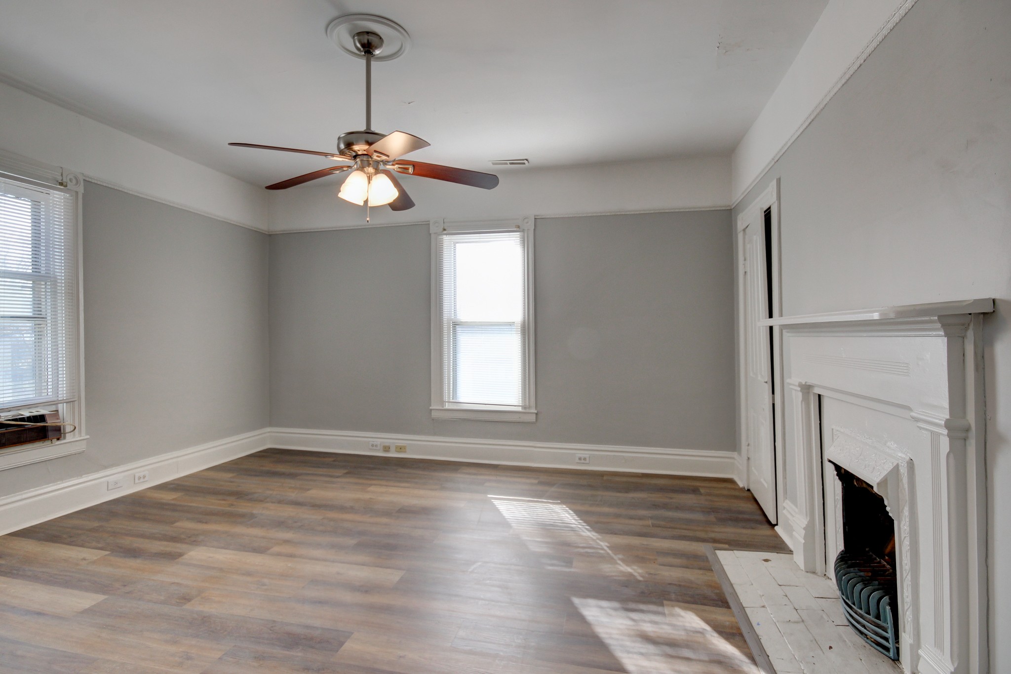 389 3rd Street Guthrie, KY 42234 - Photo 51 of 69 a view of a room with wooden floor fireplace and windows