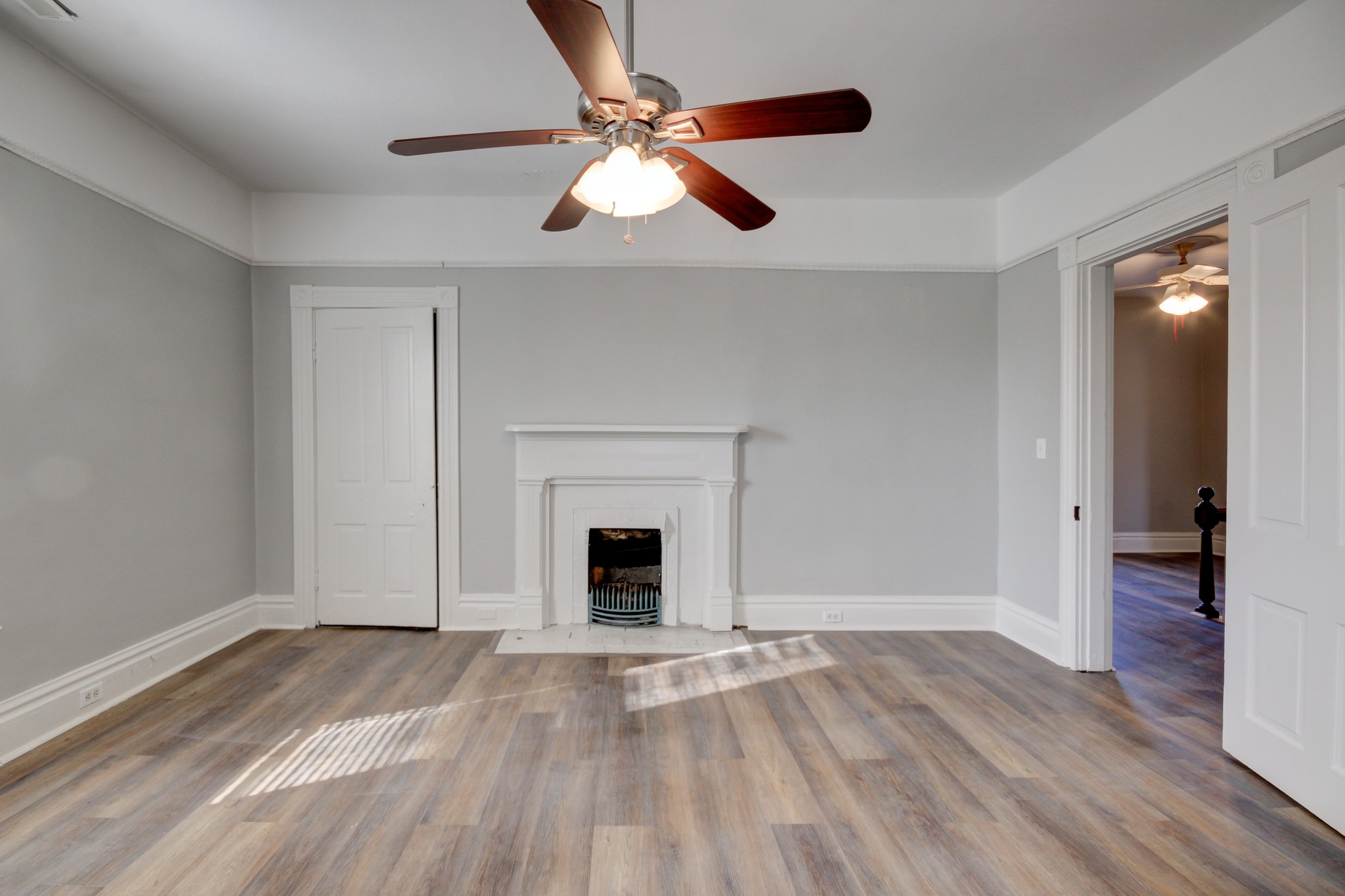 389 3rd Street Guthrie, KY 42234 - Photo 57 of 69 a view of empty room with wooden floor and fan