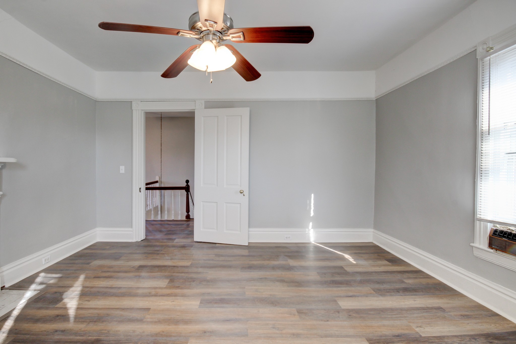 389 3rd Street Guthrie, KY 42234 - Photo 59 of 69 a view of empty room with wooden floor and fan
