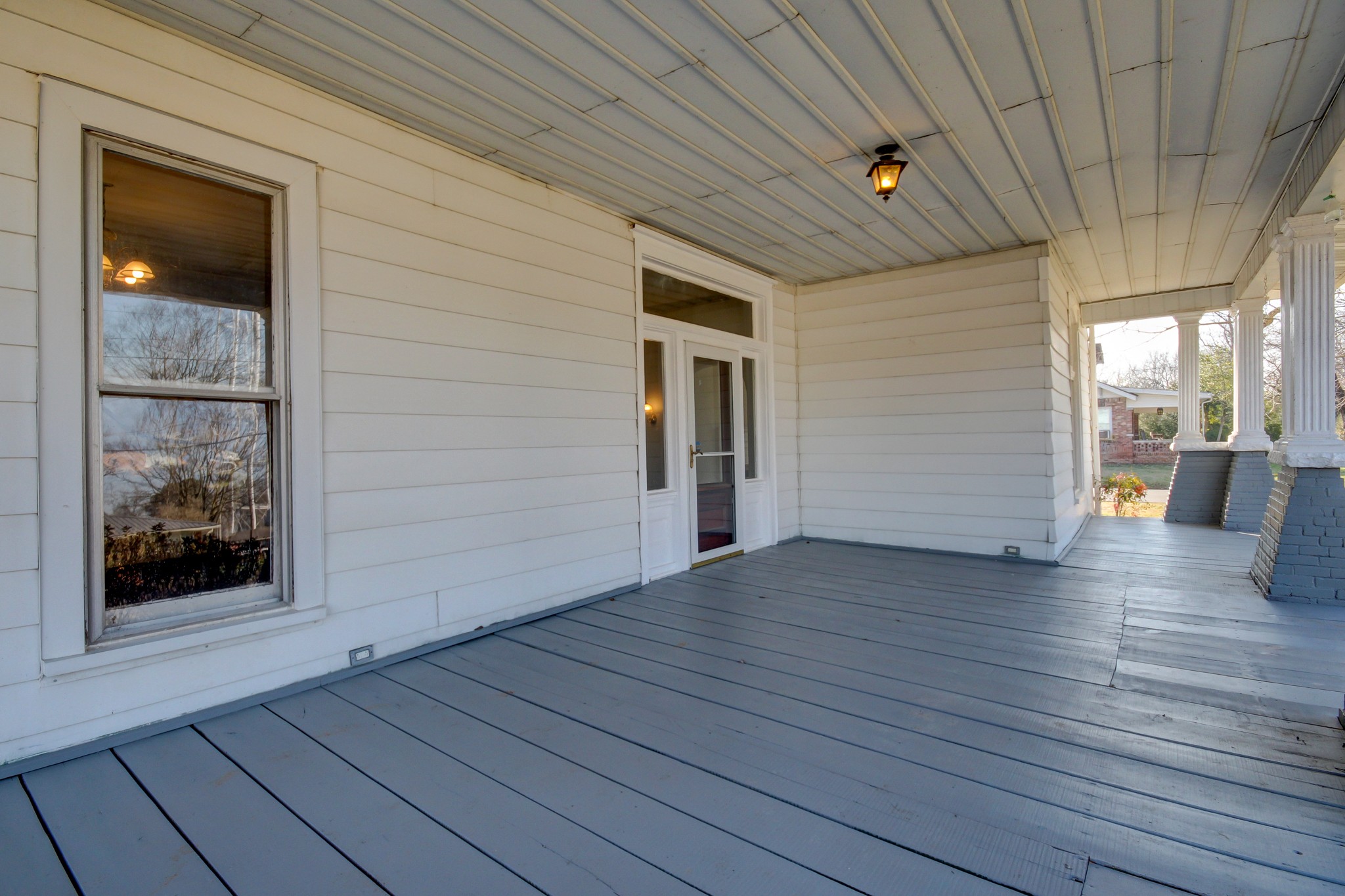 389 3rd Street Guthrie, KY 42234 - Photo 8 of 69 a view of an empty room with wooden floor and a window