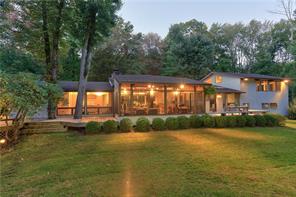 54 Lower Shad Road Pound Ridge, NY 10576 - Photo 1 of 1 a view of a house with a swimming pool
