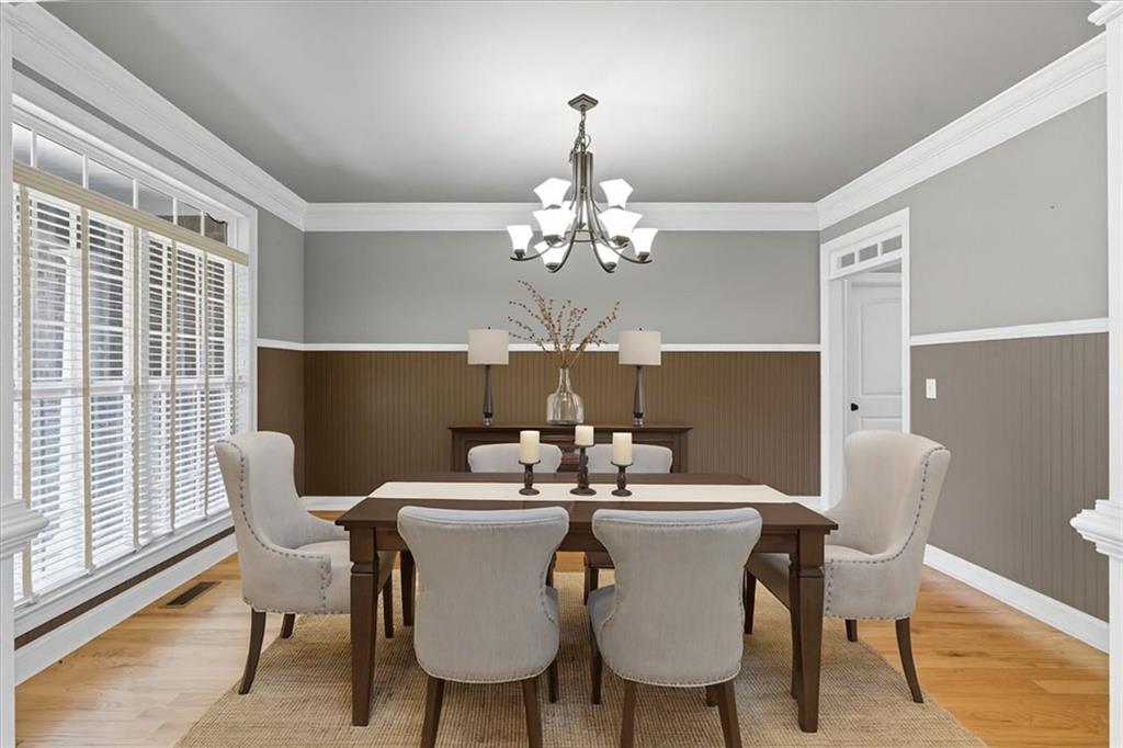 16 Nelson Boulevard Northwest Rome, GA 30165 - Photo 11 of 43 a view of a dining room with furniture and chandelier