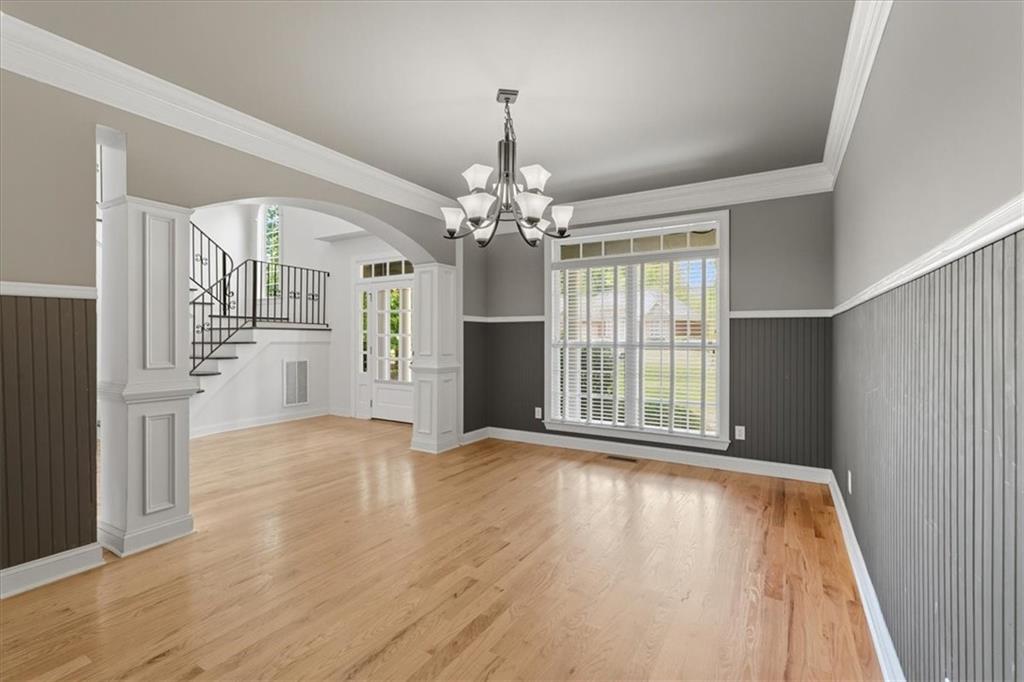 16 Nelson Boulevard Northwest Rome, GA 30165 - Photo 12 of 43 a view of an empty room with wooden floor and a window