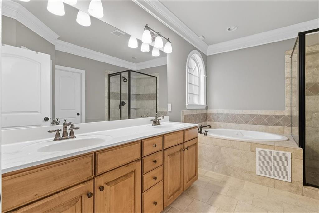 16 Nelson Boulevard Northwest Rome, GA 30165 - Photo 14 of 43 a bathroom with a tub sink and mirror
