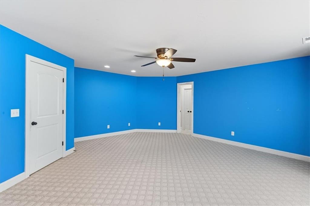 16 Nelson Boulevard Northwest Rome, GA 30165 - Photo 20 of 43 a view of an empty room with a chandelier fan
