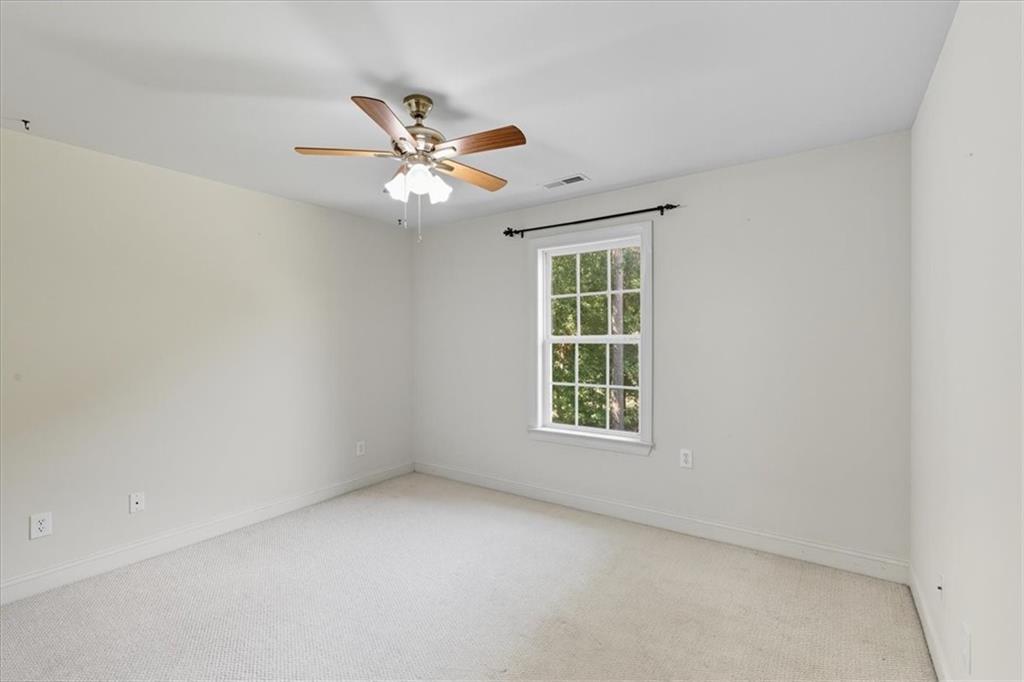 16 Nelson Boulevard Northwest Rome, GA 30165 - Photo 24 of 43 an empty room with a window and ceiling fan