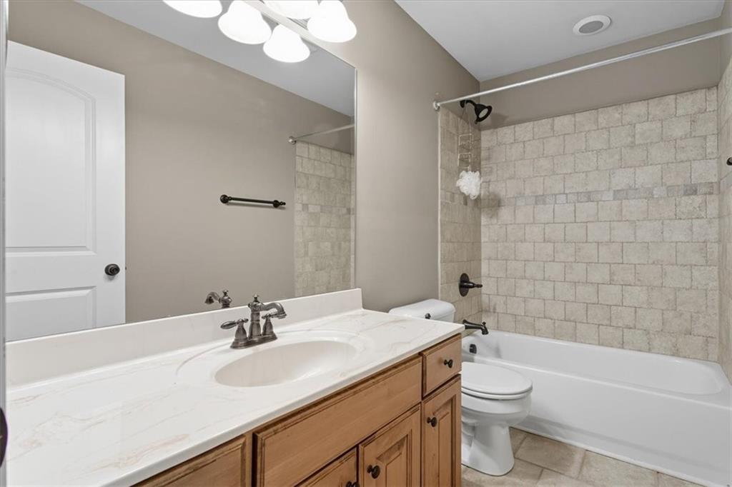 16 Nelson Boulevard Northwest Rome, GA 30165 - Photo 25 of 43 a bathroom with a sink a toilet and shower