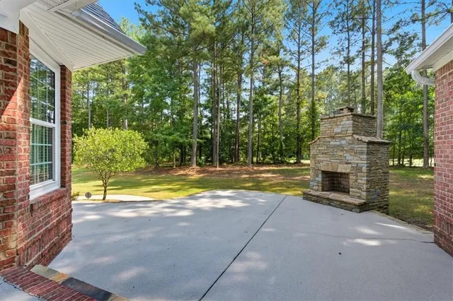 a view of swimming pool with a patio