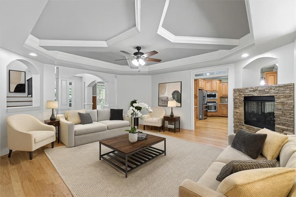 16 Nelson Boulevard Northwest Rome, GA 30165 - Photo 4 of 43 a living room with furniture ceiling fan and a fireplace