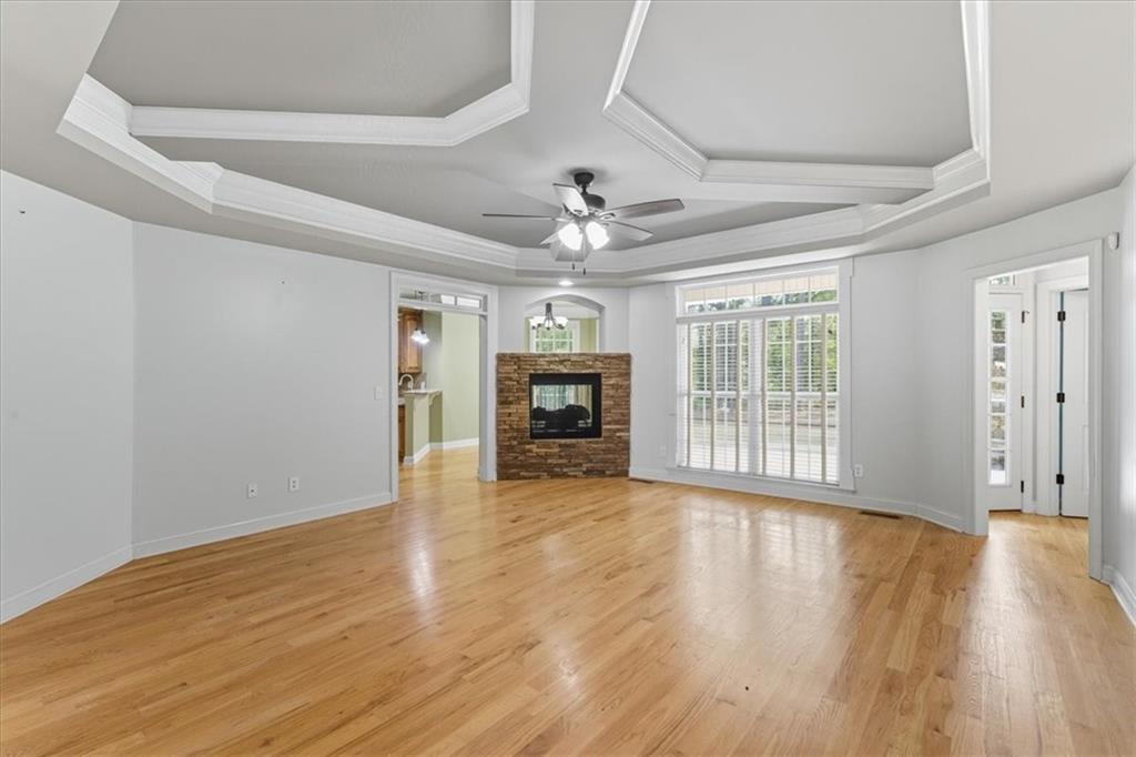 16 Nelson Boulevard Northwest Rome, GA 30165 - Photo 5 of 43 a view of an empty room with wooden floor fireplace and a window