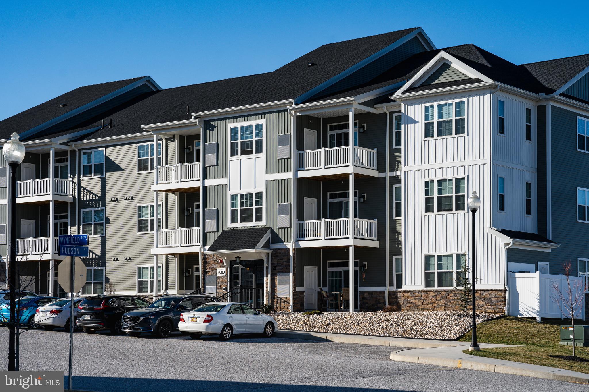 2960 Ashwood Circle, Unit 106 Harrisburg, PA 17110 - Photo 1 of 26 a front view of a residential apartment building with a street
