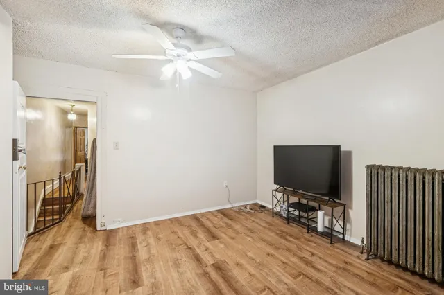 a room with a bed and a flat screen tv