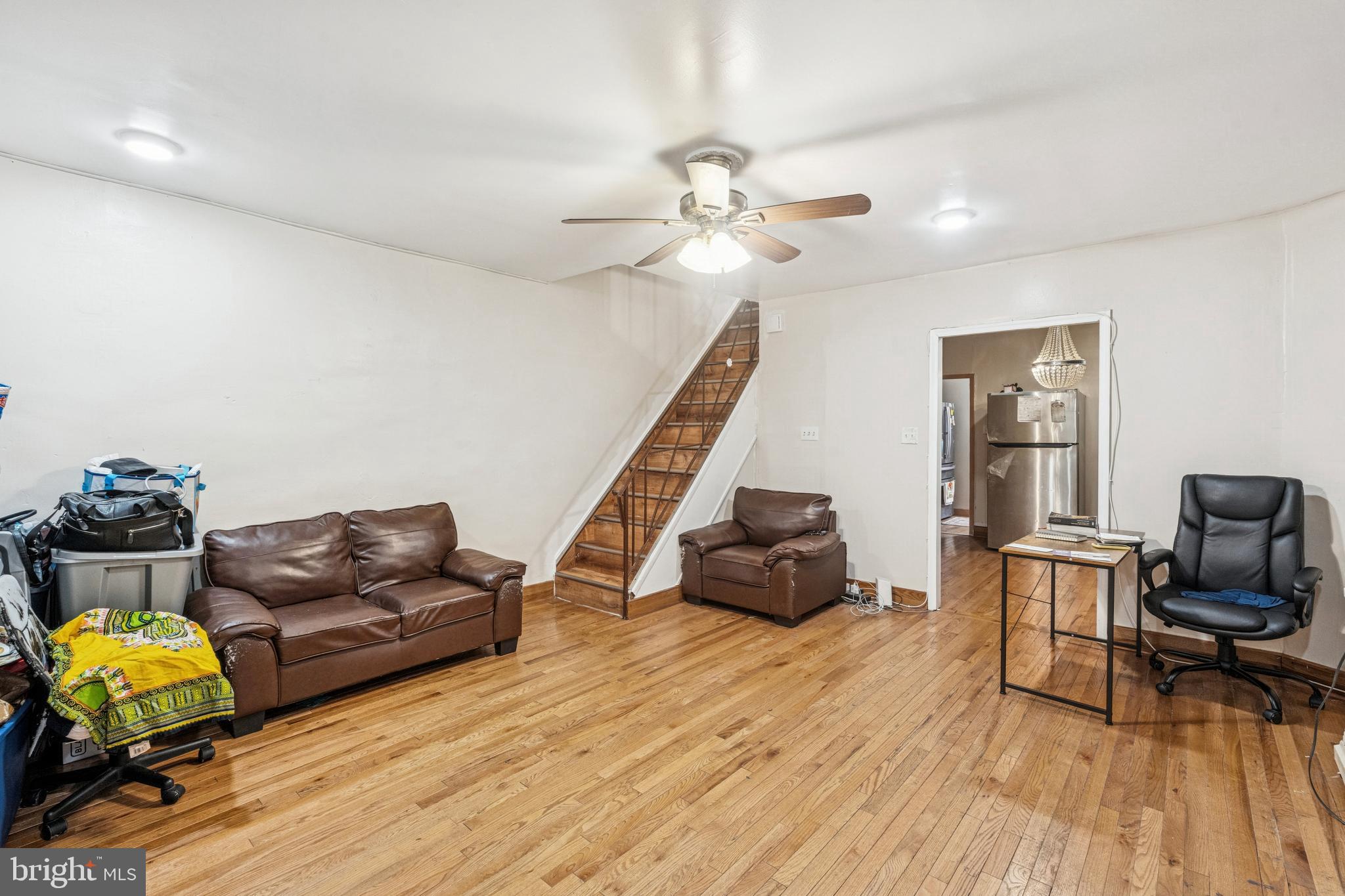 4725 Rosehill Street Philadelphia, PA 19120 - Photo 13 of 26 a living room with furniture and a wooden floor