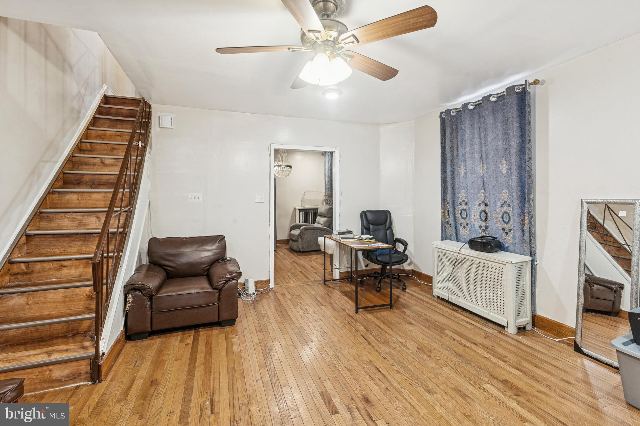 4725 Rosehill Street Philadelphia, PA 19120 - Photo 14 of 26 a living room with furniture and a fireplace