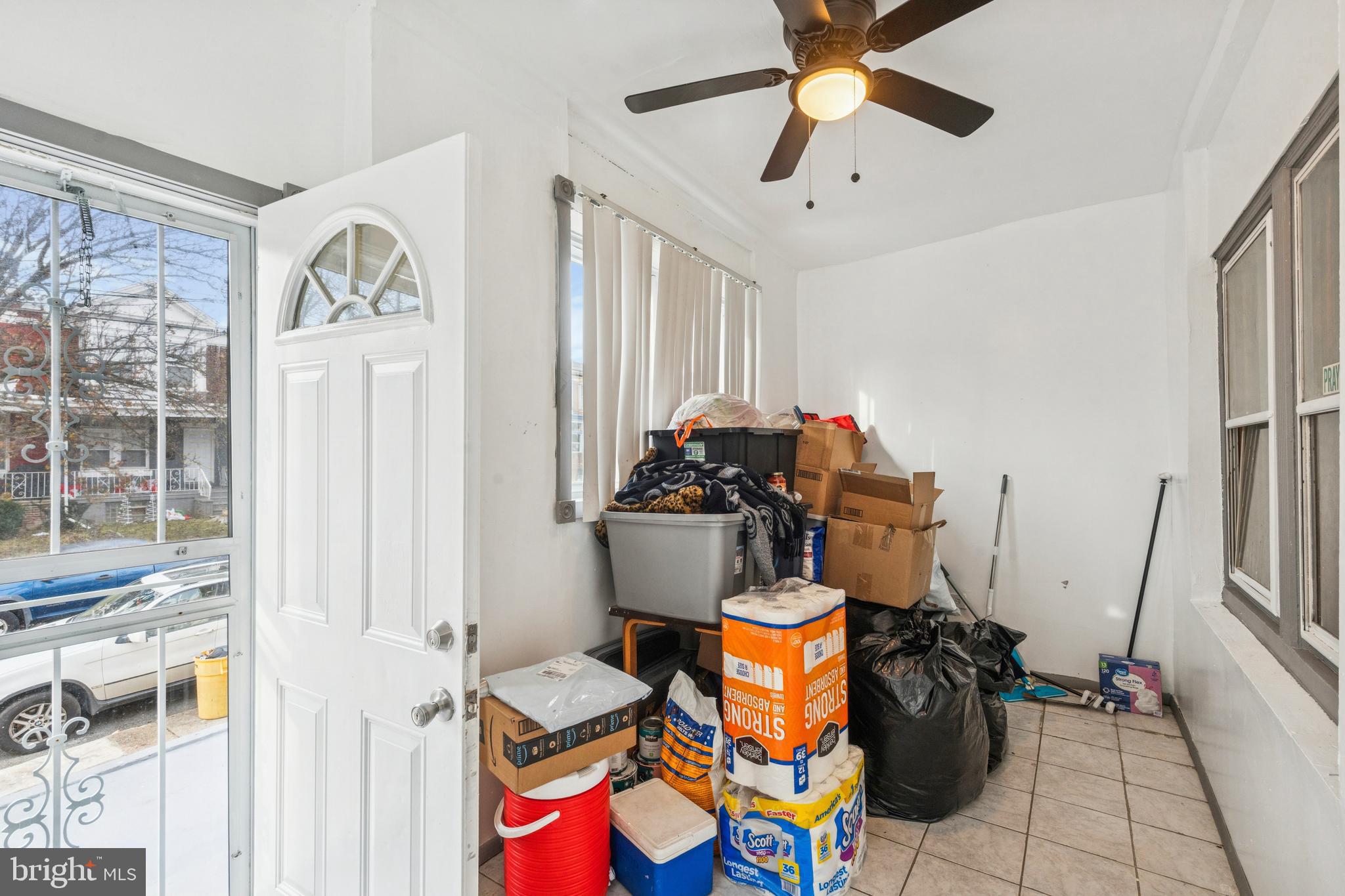 4725 Rosehill Street Philadelphia, PA 19120 - Photo 26 of 26 a living room with furniture and a chandelier