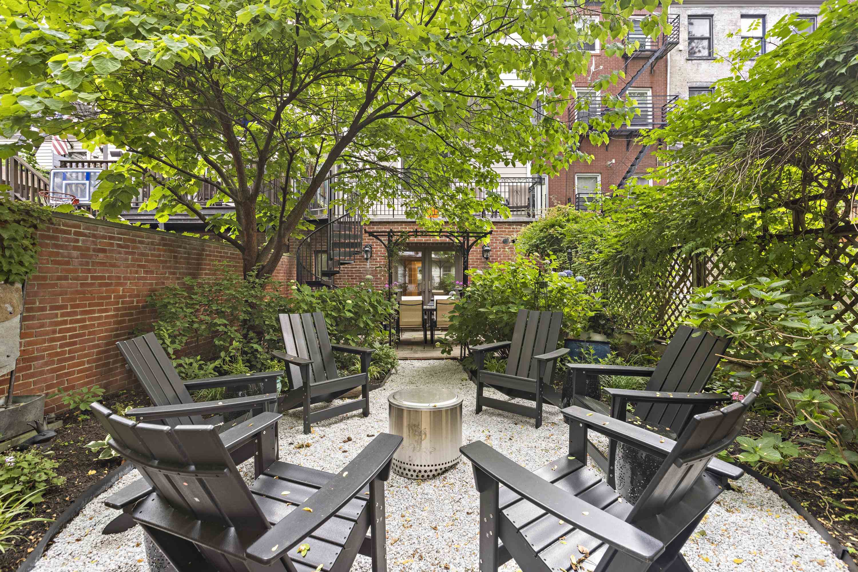 720 Bloomfield Street, Unit 1 Hoboken, NJ 07030 - Photo 11 of 13 a view of a patio with table and chairs and potted plants