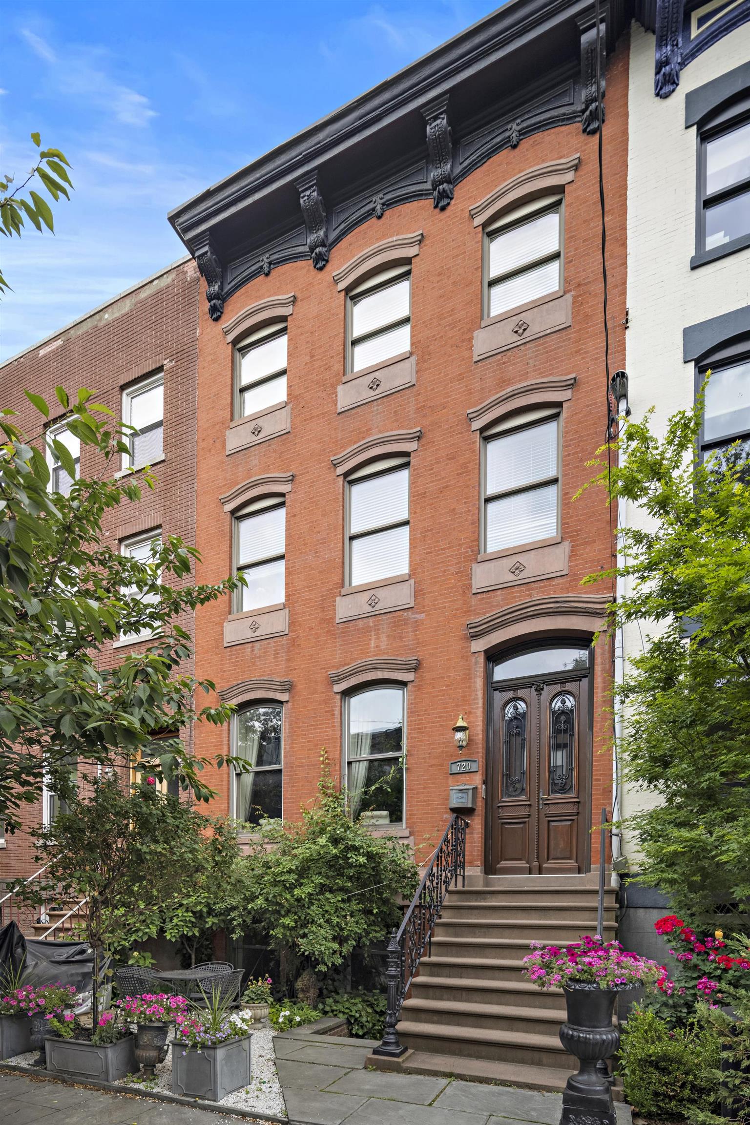 720 Bloomfield Street, Unit 1 Hoboken, NJ 07030 - Photo 13 of 13 a front view of a house with a yard