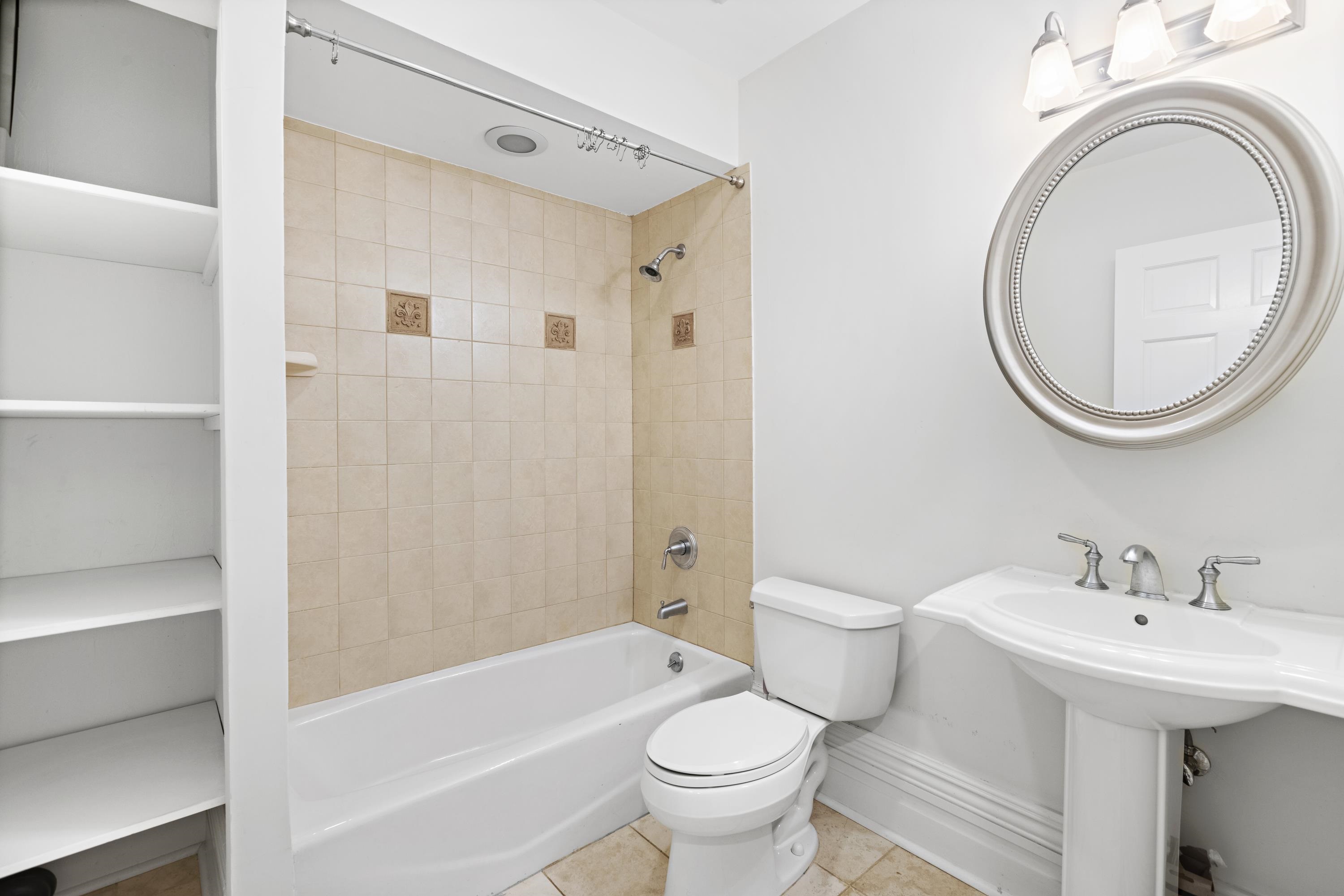 720 Bloomfield Street, Unit 1 Hoboken, NJ 07030 - Photo 8 of 13 a bathroom with a sink a toilet and a mirror
