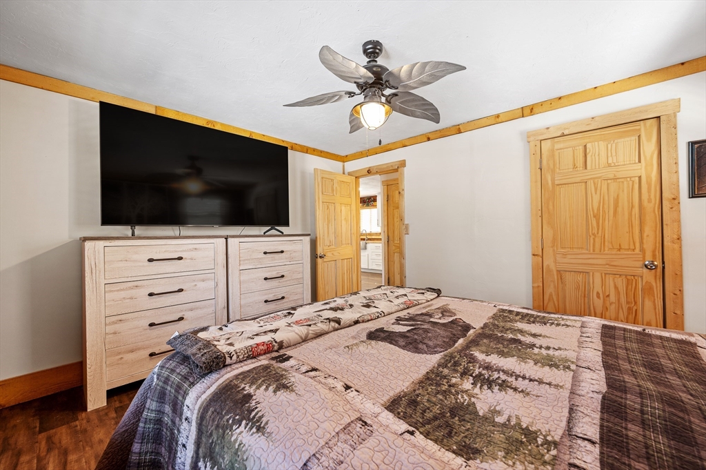 76 Wheeler Road Princeton, MA 01541 - Photo 13 of 42 a bedroom with a bed and a flat screen tv