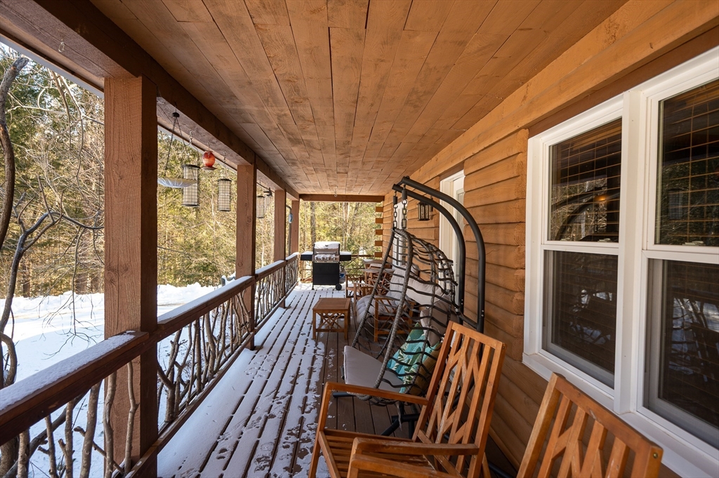 76 Wheeler Road Princeton, MA 01541 - Photo 29 of 42 a view of balcony with furniture and wooden floor