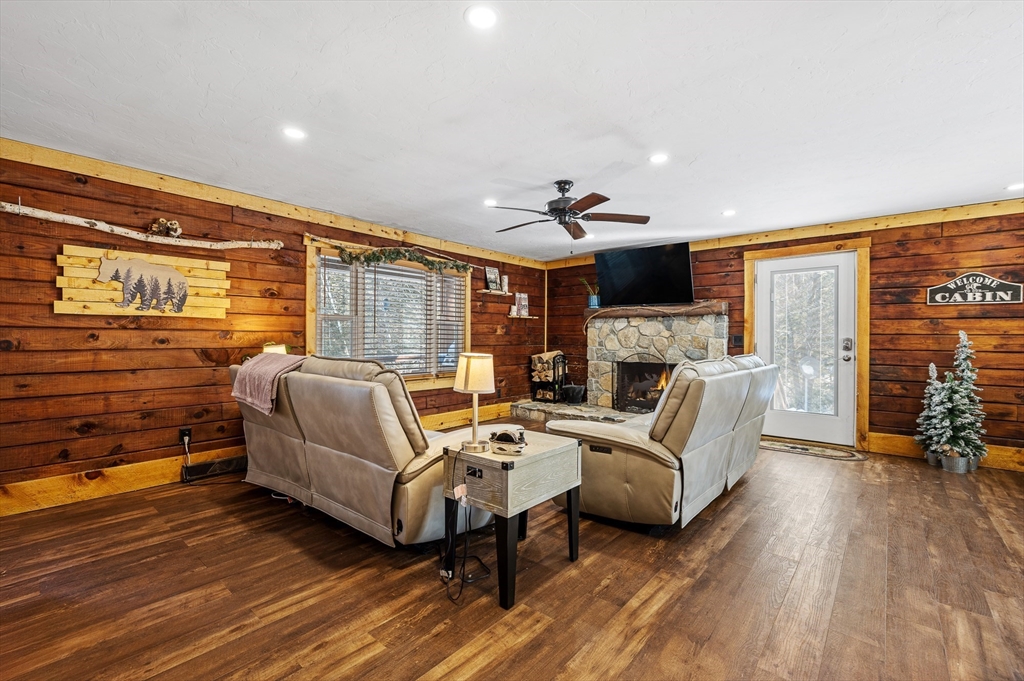 76 Wheeler Road Princeton, MA 01541 - Photo 3 of 42 a living room with furniture and a fireplace