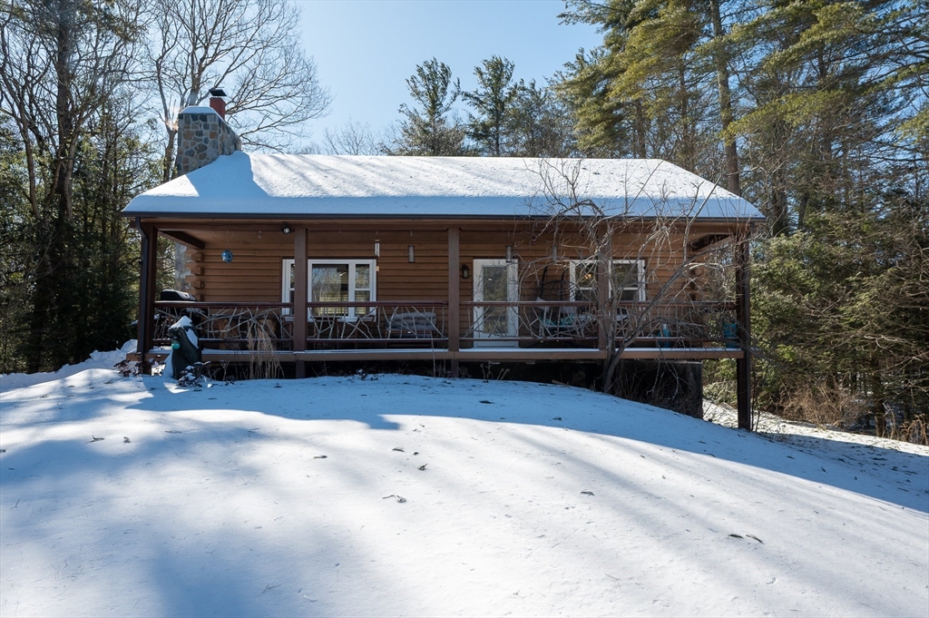76 Wheeler Road Princeton, MA 01541 - Photo 40 of 42 a view of a house with a yard and sitting area