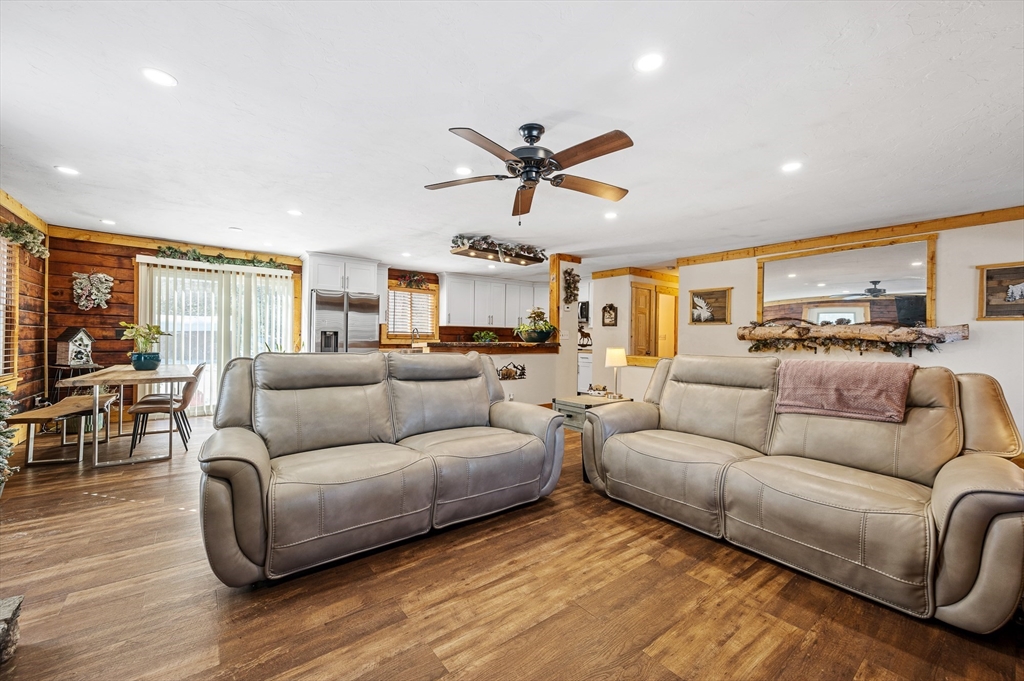 76 Wheeler Road Princeton, MA 01541 - Photo 6 of 42 a living room with furniture ceiling fan and a wooden floor
