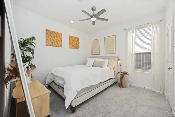 a bed room with a bed and a window
