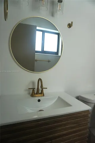 a close view of sink mirror and window