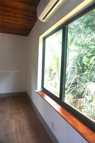 a view of lot of window in an empty room