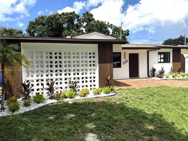 a front view of a house having yard