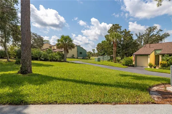 a view of a house with a big yard