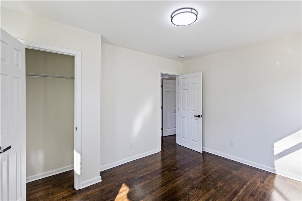 3252 Pinehill Drive Decatur, GA 30032 - Photo 17 of 26 an empty room with wooden floor and windows