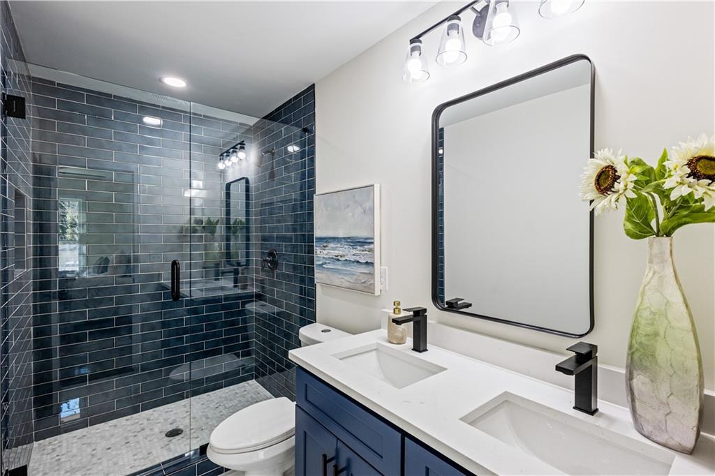 3252 Pinehill Drive Decatur, GA 30032 - Photo 20 of 26 a bathroom with a sink a toilet and shower