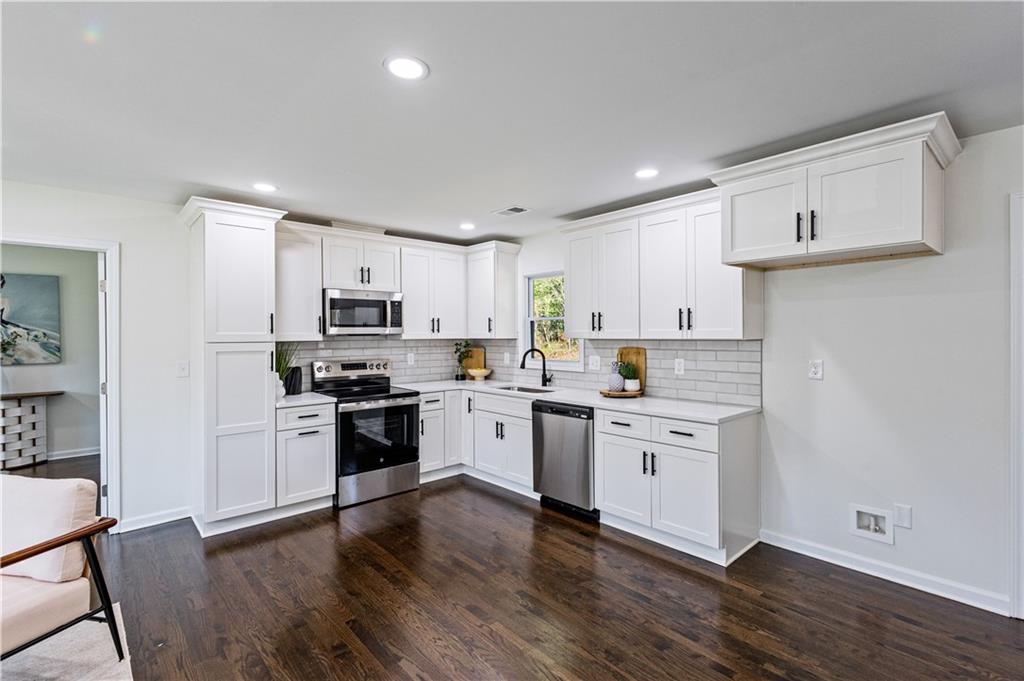 3252 Pinehill Drive Decatur, GA 30032 - Photo 8 of 26 a kitchen with a white cabinets and wooden floor